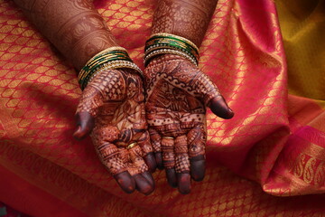 mehndi an art on hands of a bride in Indian tradition