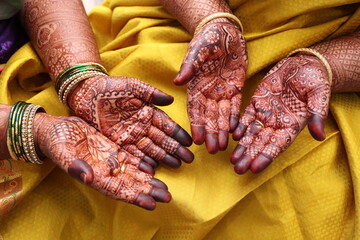 mehndi an art on hands of a bride in Indian tradition