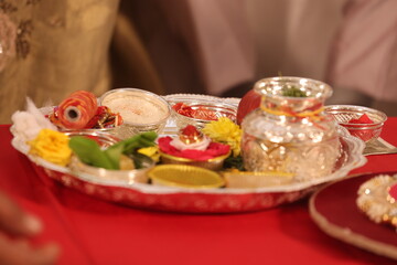 varisai thatu arrangement of plates with food items like snacks, fruits and décor item as a part of Indian tradition for any auspicious Hindu event