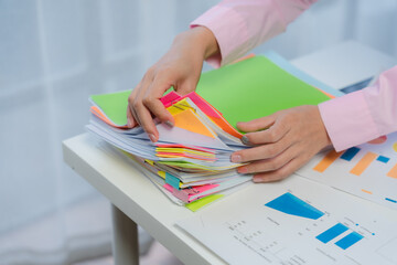 Woman Organizing Documents and Business Reports