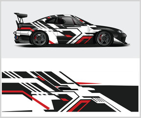 Obraz premium Sleek Sports Car with a Modern Black White and Red Geometric Wrap