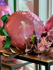 Champagne Glasses with balloon and floral decorations