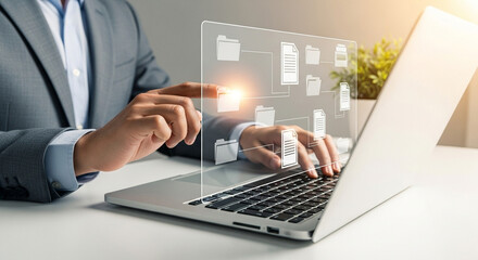 A person using a laptop with document and folder icons displayed on a transparent screen overlaying it
