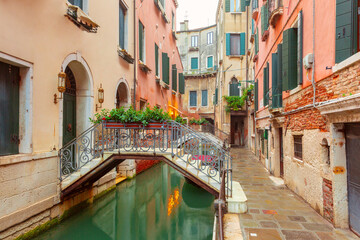 Fototapeta premium Traditional residential buildings with flowered balconies in Venice, Italy