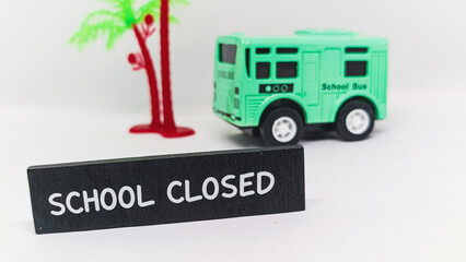 "School Closed" sign, toy bus, and palm tree represent holidays, closures, or unforeseen events.