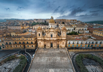 Cattedrale di San Nicolo ancient catholic cathedral and Palazzo Ducezio on cloudy day, Noto, Italy