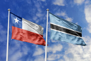 Flags of Chile and Botswana Waving Together Against a Bright Blue Sky, Symbolizing Diplomatic Ties and International Relations