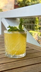 Refreshing summer cocktail with mint and lime in crystal glass