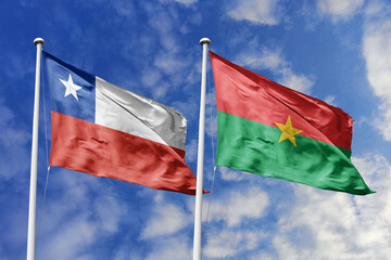 Flags of Chile and Burkina Faso Waving Under a Bright Blue Sky, Symbolizing Diplomatic Relations and International Friendship