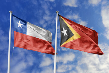 Flags of Chile and East Timor (Timor-Leste) Waving Together Against a Dynamic Blue Sky, Symbolizing...