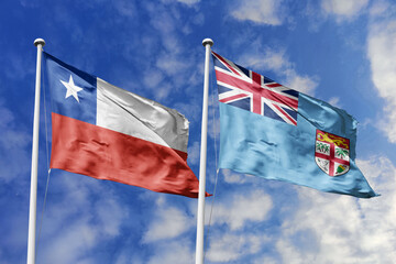Flags of Chile and Fiji Waving Side-by-Side Against a Bright Blue Sky, Symbolizing Diplomatic Ties and Pacific Connections
