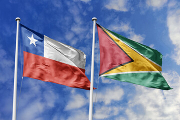 Flags of Chile and Guyana Waving Against a Bright Blue Sky, Symbolizing Bilateral Relations and...