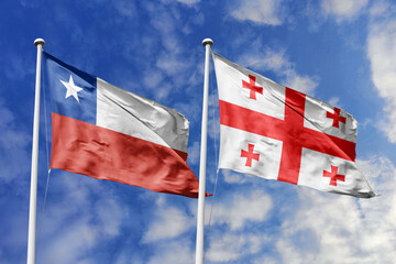 Flags of Chile and Georgia Waving Against a Bright Blue Sky, Symbolizing Diplomatic Relations and...