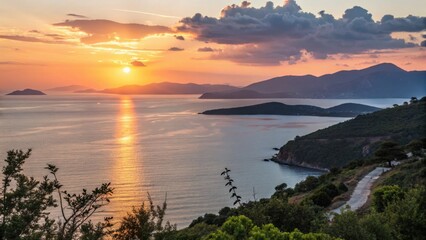 Obraz premium Scenic sunset over coastal landscape with mountains and water 