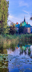 Jakabov palác (Jakab's palace) in Kosice. Lake in city park. Trees and reeds. View of the historic building in the center. Slovakia. Europe