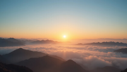 Stunning sunrise over misty mountains at dawn, illuminating the landscape with warm hues