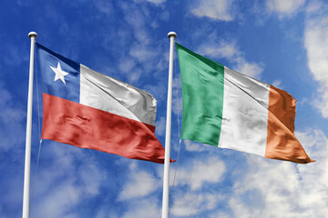 Flags of Chile and Ireland Waving Against a Cloudy Blue Sky, Symbolizing Bilateral Relations and...