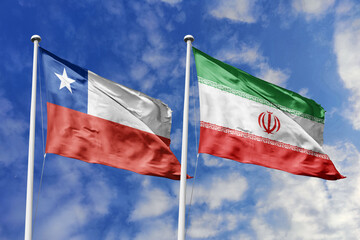 Flags of Chile and Iran Waving Together, Symbolizing Diplomatic Ties and International Relations Against a Blue Sky