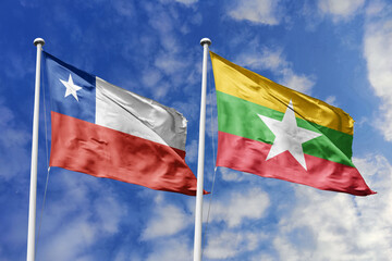 Flags of Chile and Myanmar Waving Together Against a Dynamic Blue Sky, Symbolizing International...