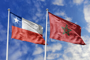 Flags of Chile and Morocco Waving Together Under a Bright Blue Sky, Symbolizing International...
