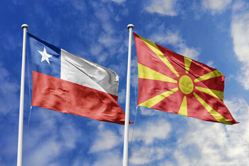 Flags of Chile and North Macedonia Waving Under a Bright Blue Sky, Symbolizing International Relations and Friendship