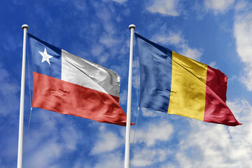 Chile and Romania flags waving under a bright sky, symbolizing unity and ties. Red, white star of...