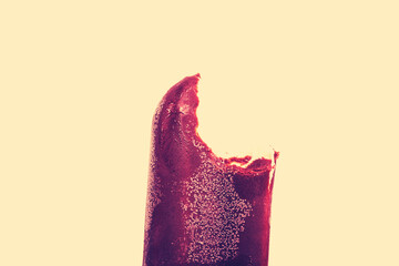Enjoying a refreshing frozen dessert with a bite taken out on a hot summer day