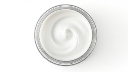 Top down view of a clear jar filled with smooth, creamy white substance on a white background