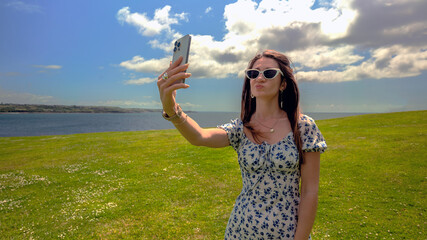 Young woman taking selfie outdoors