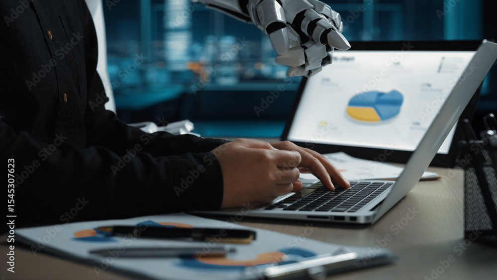 Poster a robotic hand supports a human in data analysis within a contemporary office setting. the image rep