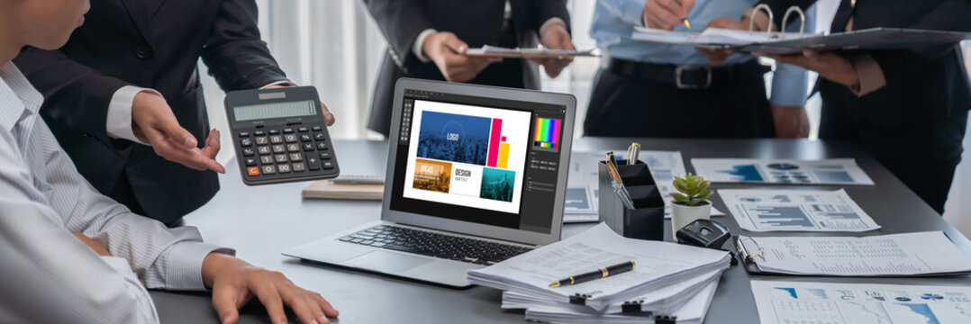 Graphic designer software for modern design of web page and commercial brisk ads showing on the computer screen