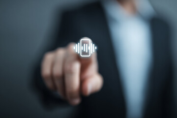 Voice messages in business. Communication with partners via voice communication. Businessman wants to touch the virtual voice message icon in front of him. Blurred background