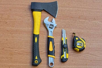 set of tools sharp black iron with plastic yellow handle grip modern small hatchet with adjustable...