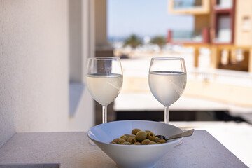 Balcony View with Olives and Two Glasses of Wine