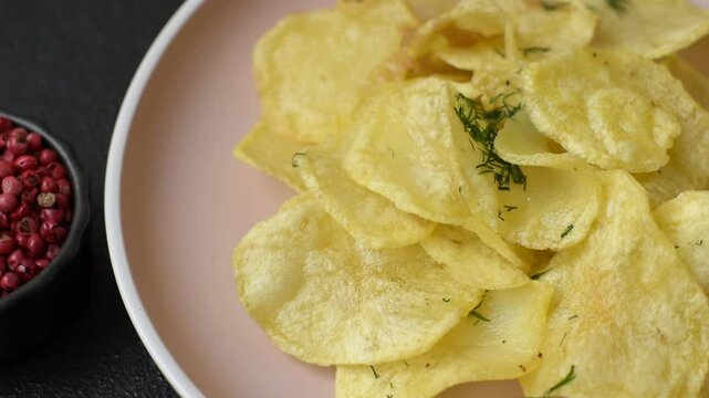Crisps fried with salt, spices and garlic. Cooked potatoes as a background for your design