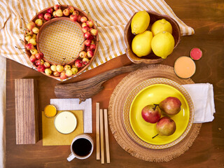Top view flat lay of a summer-inspired moodboard and color palette arranged on a rustic wooden...