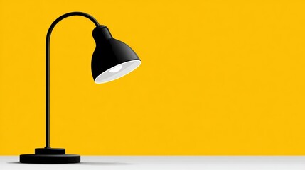 Black lamp with a white shade is lit up on a yellow background. The lamp is turned on, and the light is shining on the wall. The yellow background creates a warm and inviting atmosphere