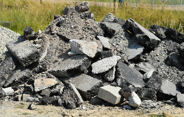 asphalt tar residue from a broken-up road, construction site debris