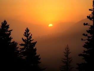 Obraz premium Sunrise through misty mountain valley