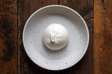 Creamy whole  burrata cheese in a bowl