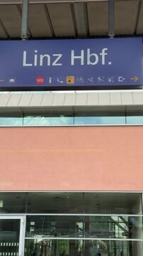 Linz main train station sign on platform