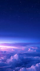 Aerial view of purple and blue cloudscape at twilight with stars