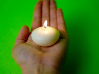 Burning Candle Held in Hand 
Lit Candle in Human Hand – Symbol of Warmth and Hope
Candle with Flame Held in Open Palm
Glowing Candle in Hand on Dark or Neutral Background

