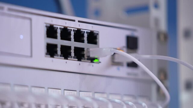 Switching hubs in IPS server room with cables and glowing lights