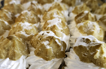 Cream filled profiteroles