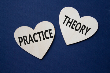 Theory or Practice symbol. Concept word Theory or Practice on wooden hearts. Beautiful deep blue...