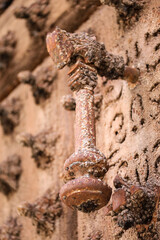 Vintage doorknocker on old wooden door