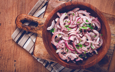 chopped red onion, with sumac and herbs, in a bowl, pickled Spanish onion, close-up, top view,