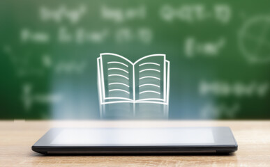 Flying book icon from digital tablet on chalkboard background. e-learning concept