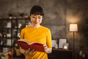 one female mature japanese woman read book at home